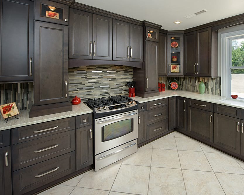 A kitchen featuring a stove, oven, and a window allowing natural light to enter the space.