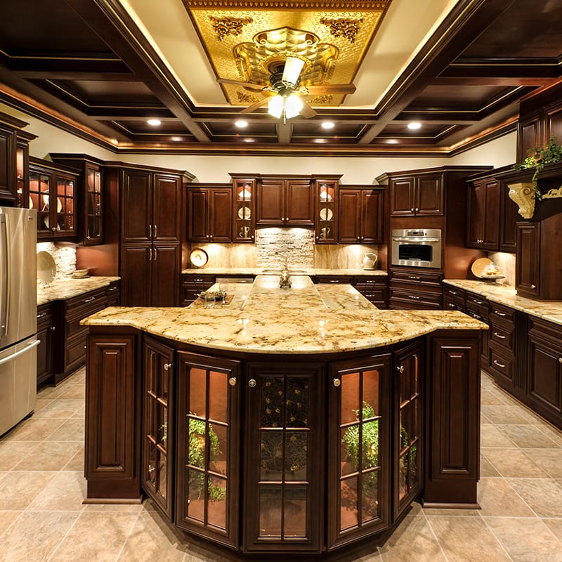 A spacious kitchen featuring a central island and dark wood cabinetry, showcasing a modern and inviting design.